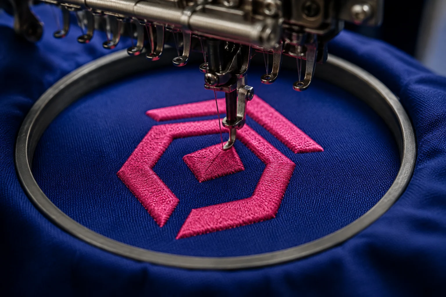 Illustration of an embroidery needle stitching pink thread onto fabric